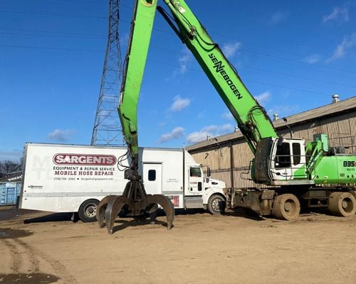 mobile hose repair truck front view with material handler
