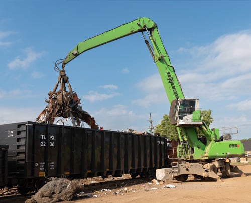 sennebogen material handler picking up scrap